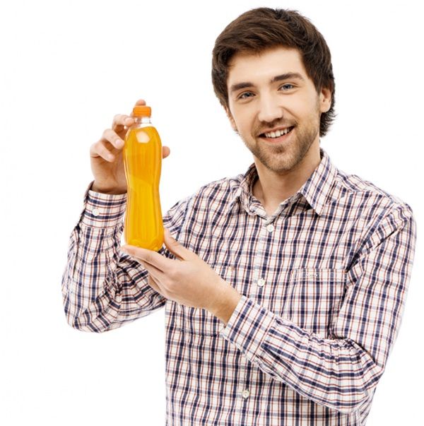 Happy man showing a bottle of vinegar with his hands representing advice