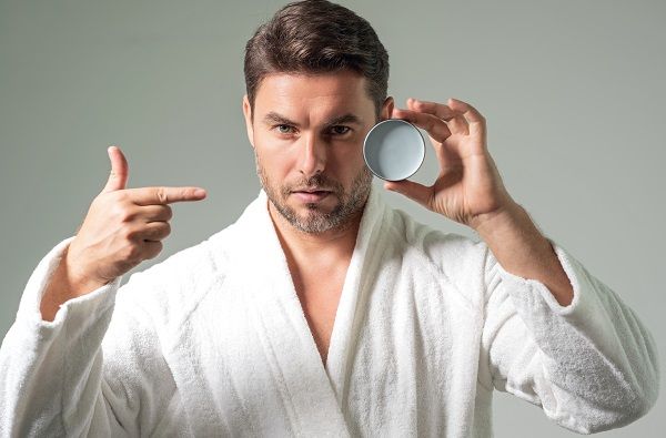 Man using hydrating leave-in products
