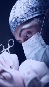 Doctor doing FUE hair transplant