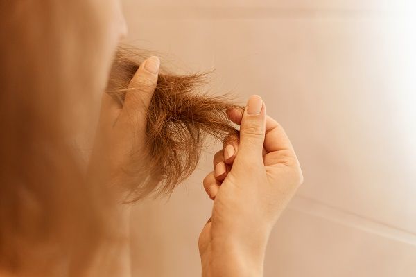 Woman untangling finger