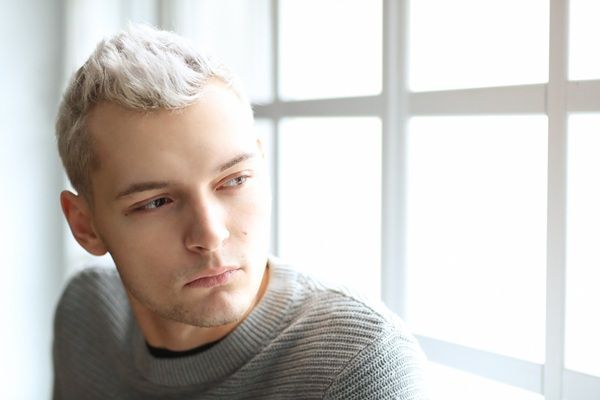 Man posing with white hair as a model