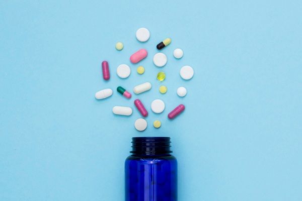 Image of medicines coming out of a bottle